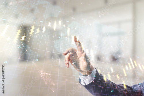 Multi exposure of trader hand presses on virtual abstract financial chart and world map on blurred office background, research and analytics concept