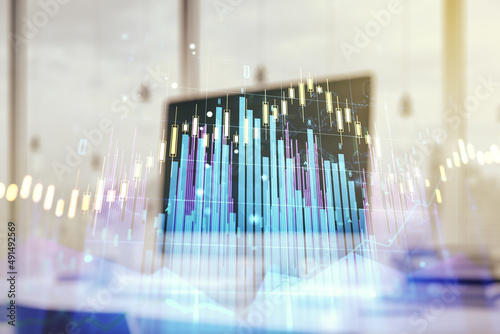 Multi exposure of abstract financial graph on laptop background, financial and trading concept © Pixels Hunter