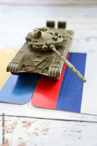 Wallpaper Mural toy tank and russian and ukrainian flags crisis risk sanctions war conflict russia ukraine wallpaper Torontodigital.ca