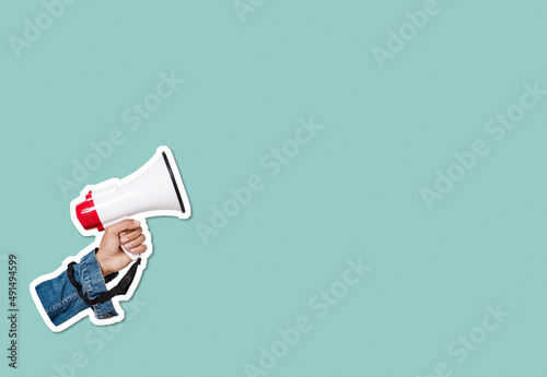 Human hand holding megaphone sticker with plenty of copy space. Collage cut out style photo