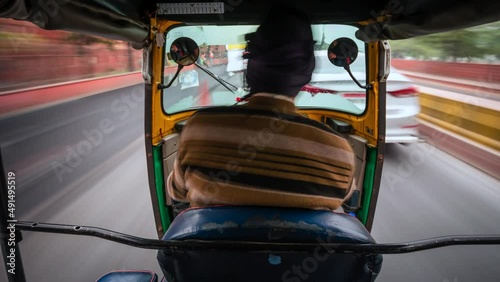 Motion time lapse view of tuk-tuk ride around Delhi, India, travel and transportation concept, Indian culture. photo