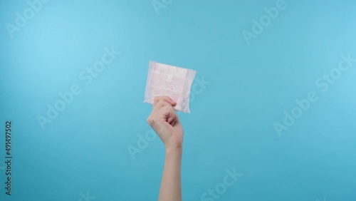 Woman hand showing sanitary pad