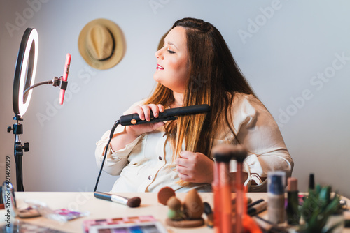 plus size blogger teaching how to straighten hair.