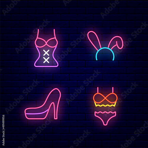 Women clothing for sex play neon icons set. Rabbit ears, high heels, corset and underwear. Vector stock illustration
