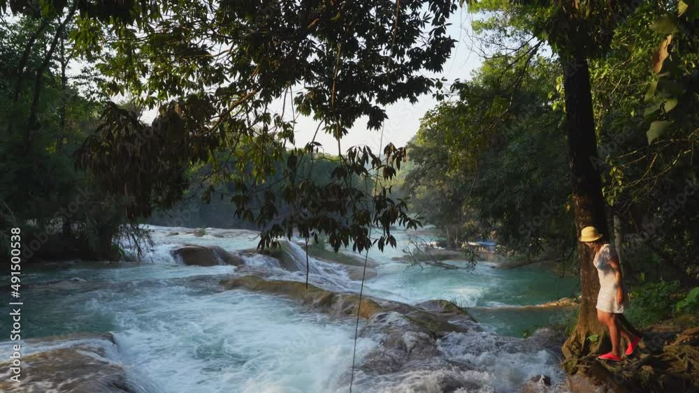 Female Tourist Visit Agua Azul Waterfalls in Chiapas, Mexico Female Tourist Visit Agua Azul Waterfalls in Chiapas, Mexico