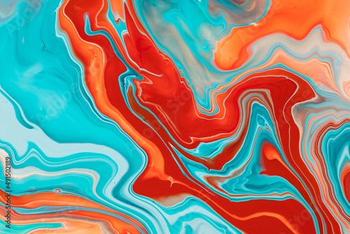 A fluid art texture that was created by mixing colored paints. An abstract fluent background with colorful waves and swirling shapes. Liquid style backdrop with mixture of colorants.