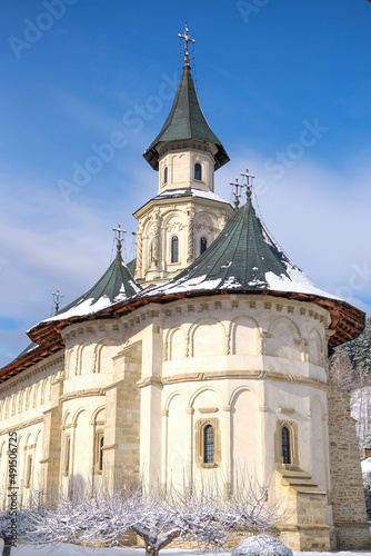 Landscape of a religious transilvanian romanian monastery built in a rustic style photo