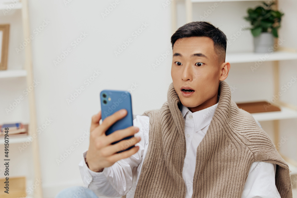 handsome man home with smartphone in chair interior internet handsome man home with smartphone in chair interior internet