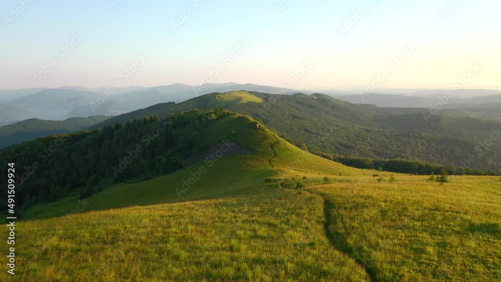Shooting from a quadcopter of green meadows in the alpine highlands. Filmed in UHD 4k video. Shooting from a quadcopter of green meadows in the alpine highlands. Filmed in UHD 4k video.