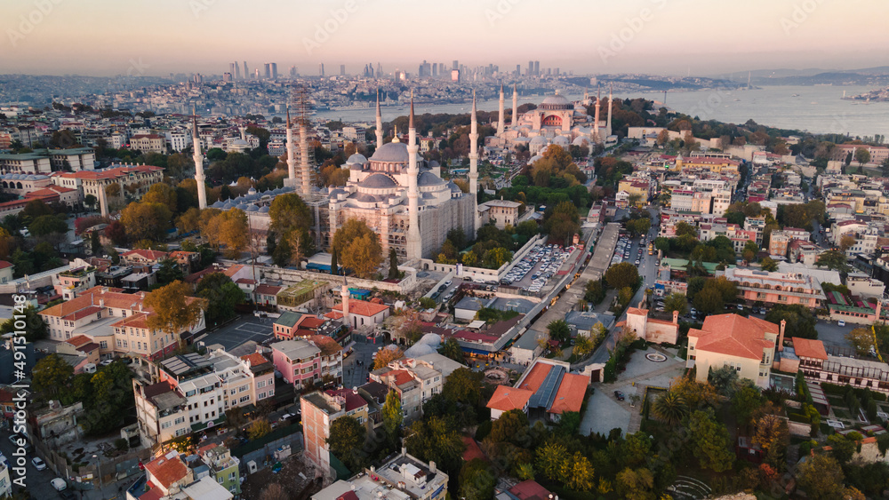 Aerial view of Blue Mosque with six minarets in Istanbul, Turkey. Top view of tourist famous place Sultanahmet Camii  in the old city center on sunset