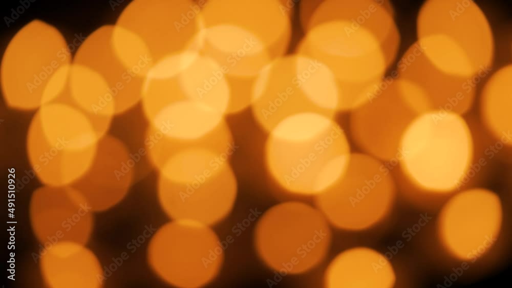 Blurred burning candles on a black background Blurred burning candles on a black background