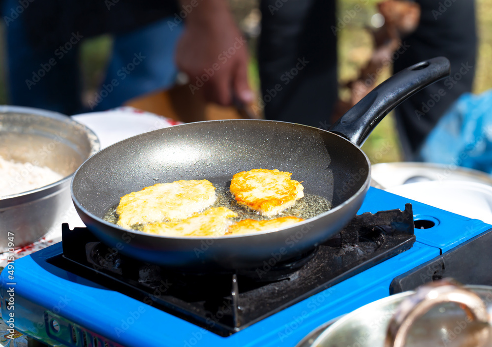 Fried potato pancakes in a pan