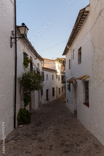 Street in the old town of Grazalema white village in the Natural Park of Grazalema mountain range in the light of day  Cadiz  Andalusia  Spain
