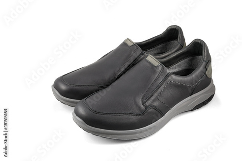 Black leather shoes isolated on white background. Full depth of field. Close-up.