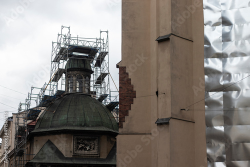 Lviv, Ukraine - March 8, 2022. The war in Ukraine. A statue of Christ was removed from the roof of the Boim Chapel to preserve it. photo