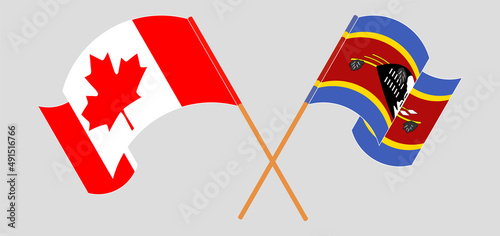 Crossed and waving flags of Canada and Eswatini