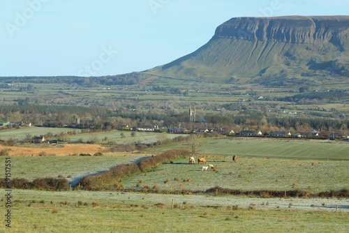 Landscape of north County Sligo  Ireland on winter morning featuring fields of farmland pastures against backdrop of Benbulben mountain