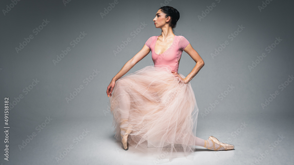 young pretty, fragile, beautiful ballerina dancing in a long pale