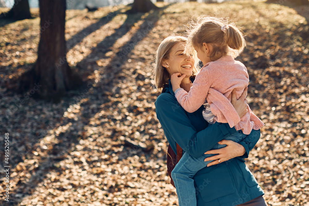 Happy mother enjoys while spending day with her daughter in the park. Happy mother enjoys while spending day with her daughter in the park.
