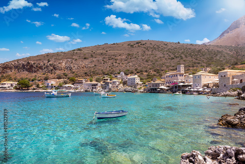 The idyllic fishing village of Limeni on the south coast of Mani, Peloponnese, Greece, with turquoise sea during summer time