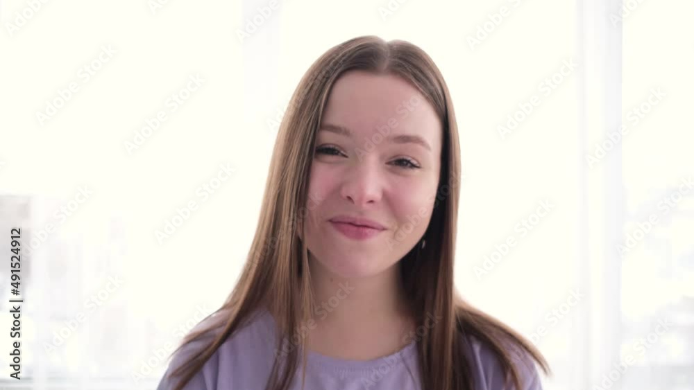 Beautiful woman laughing while looking at camera Beautiful woman laughing while looking at camera