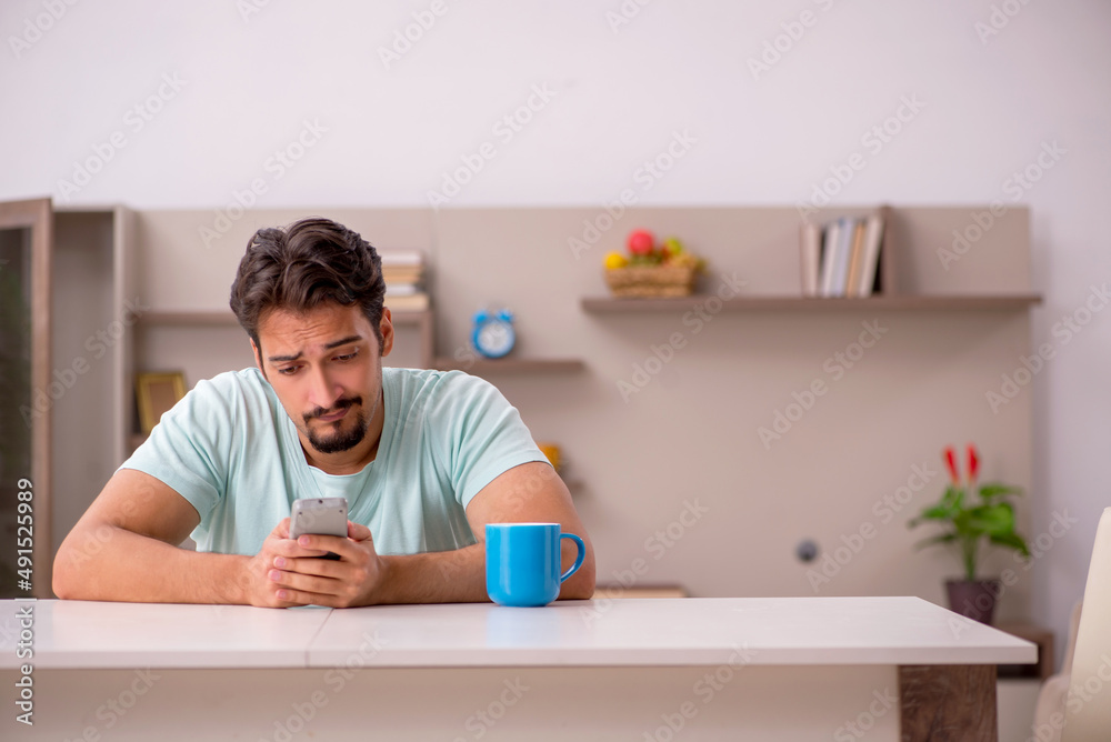 Young man watching tv at home Young man watching tv at home