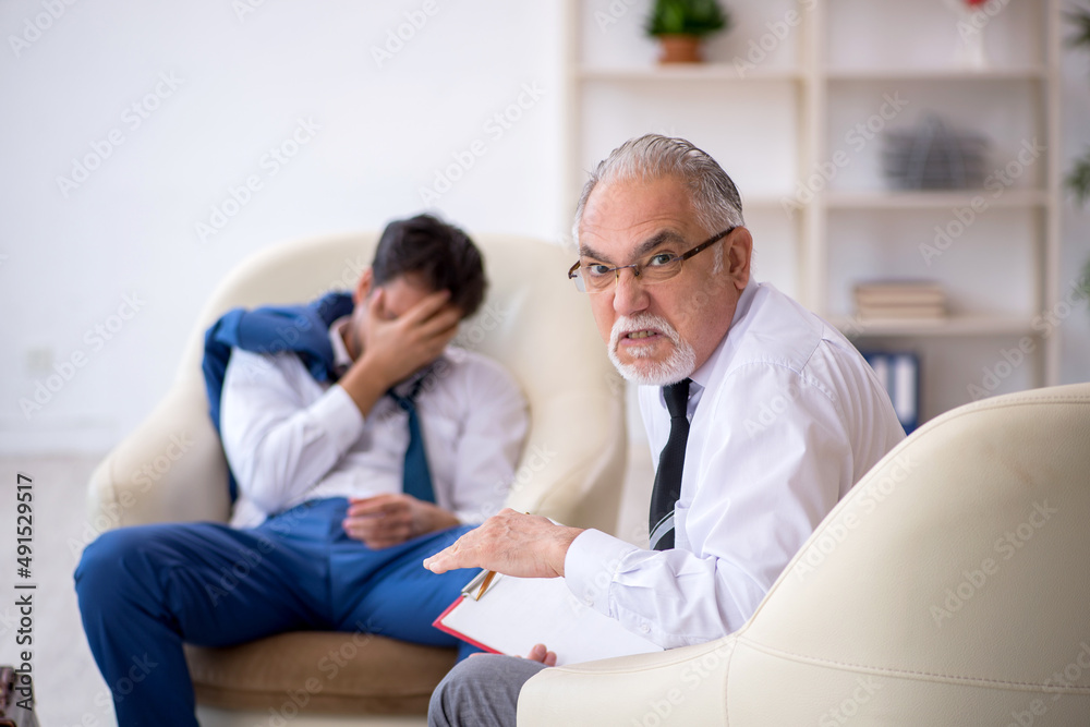 Young businessman employee visiting psychologist Young businessman employee visiting psychologist