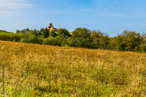 Panoramic landscape view of traditional saxon Viscri village with the fortified evangelical church in Viscri, Brasov country, Transylvania, Romania photo