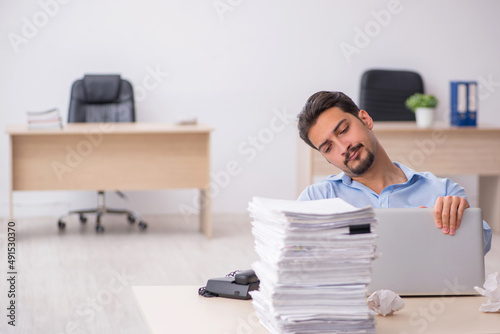 Young male employee rejecting new ideas in the office