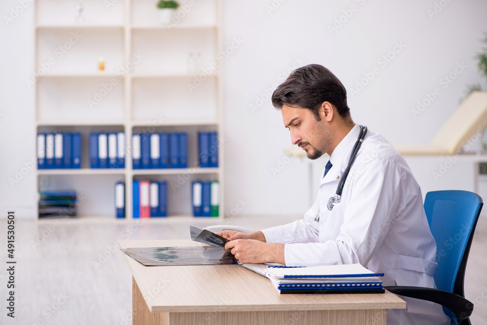 Young male doctor radiologist working in the clinic Young male doctor radiologist working in the clinic