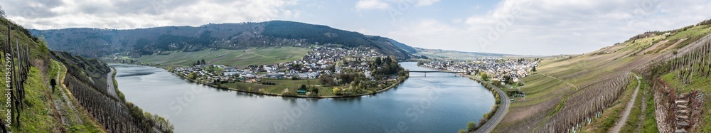Mehring, Rhineland- Palatinate - Germany  - View over the village of Mehring with the meandering Moselle river surrounded by vineyards on the green hills
