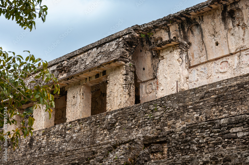 Decorative carvings on a palace wall in the ancient Maya city of Palenque, Chiapas, Mexico. Palenque is famous for its decorative stucco sculpture and low-relief carvings some of the best in Maya art.
