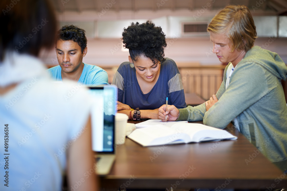 Working together to prepare for finals. A group of young people studying together for the upcoming exams. Working together to prepare for finals. A group of young people studying together for the upcoming exams.