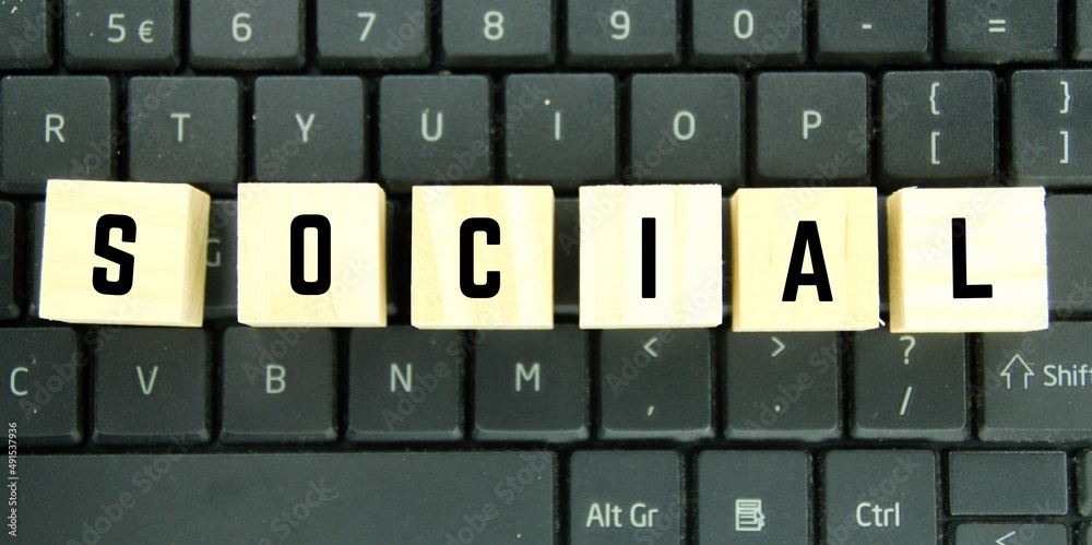 laptop keyboards and wooden kib with the word social laptop keyboards and wooden kib with the word social