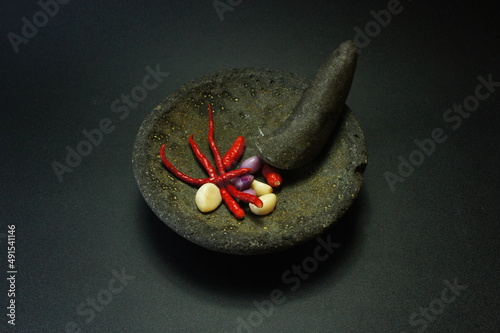 Cobek or Ulekan is a pair of tools that have been used since ancient times to pound, grind, pulverize, grind, and mix certain ingredients. photo