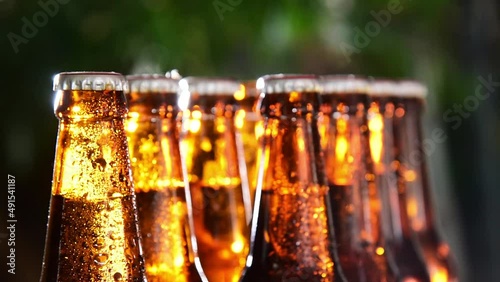 person hand picking beer bottle beer