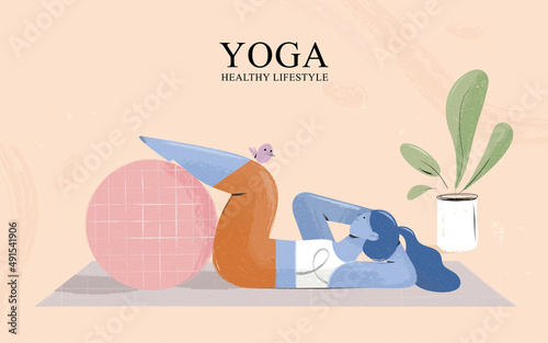 Woman doing yoga with fitness ball