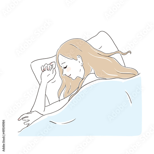 ベッドで安眠する美しい女性
