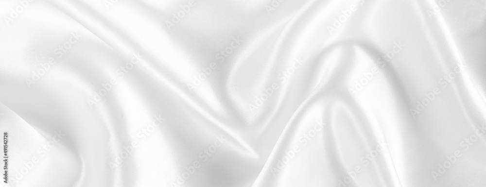 Abstract white silk fabric texture background. Creases of satin