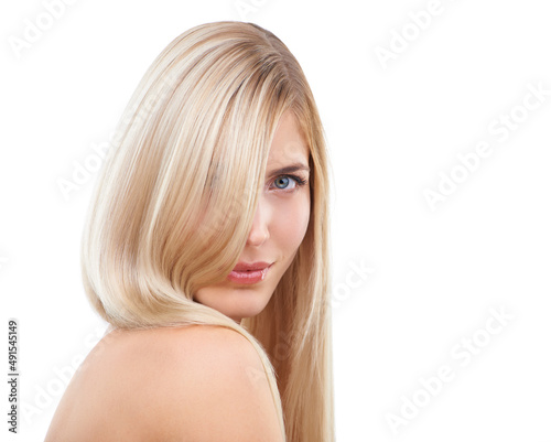 Blonde and beautiful. Studio portrait of a young woman with long blonde hair.