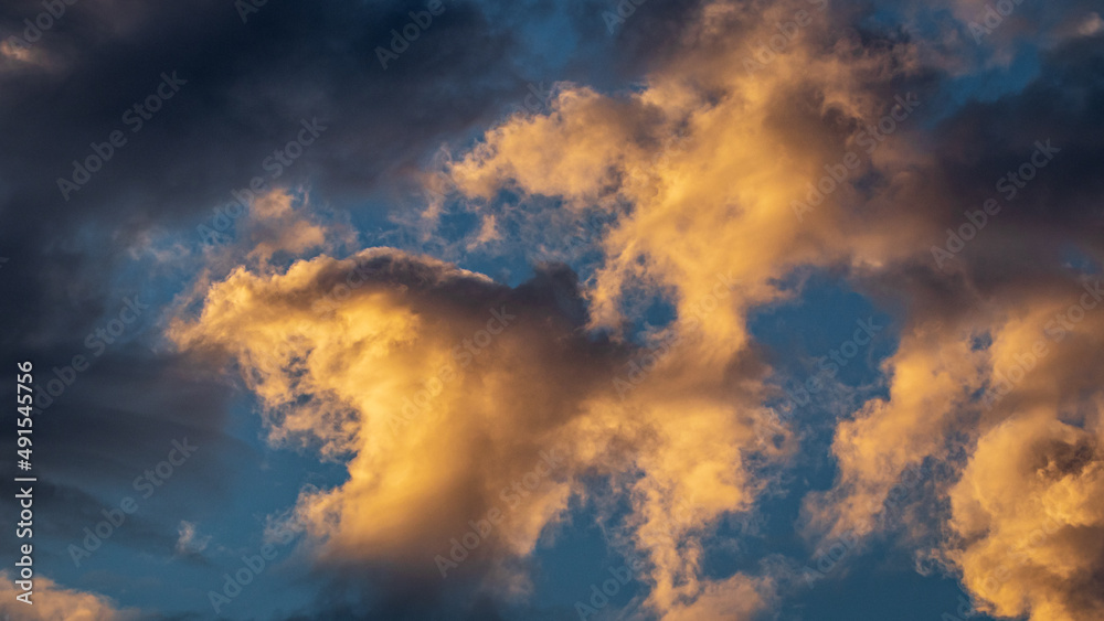 Blue Sky With Orange and White Clouds during sunset