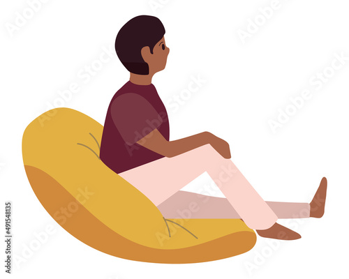 guy sitting on bean chair