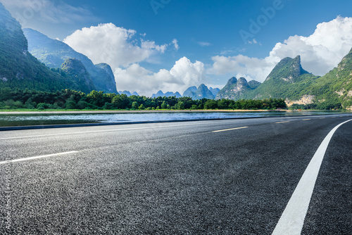 Asphalt highway and mountain natural scenery under blue sky in summer