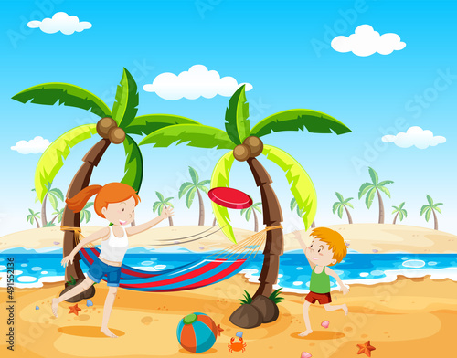 Scene with boy and girl playing frisbee on beach