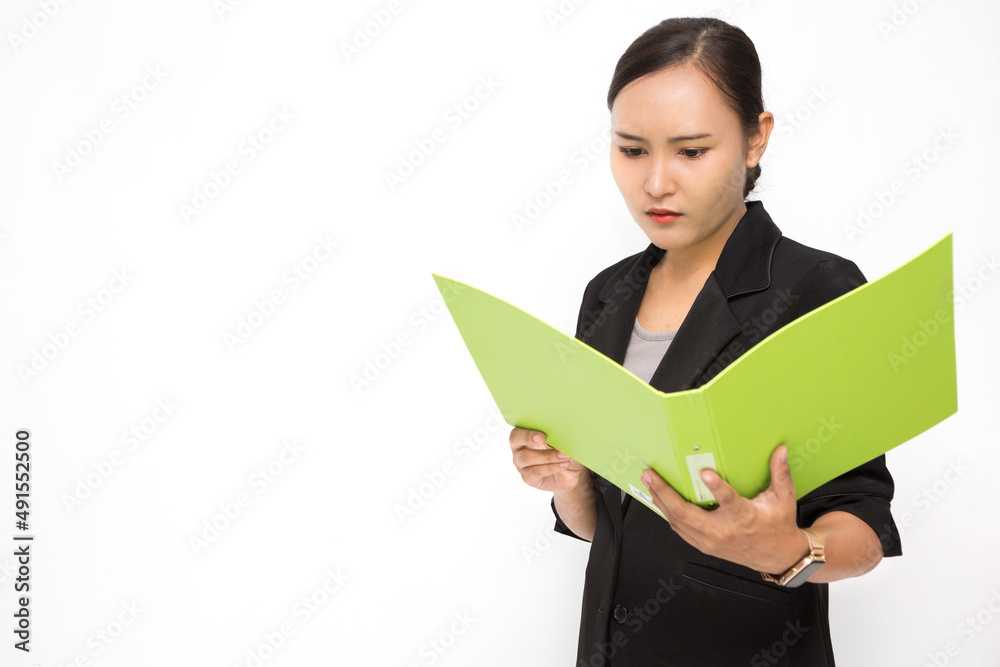 Beautiful Asian business woman wearing black suit look at document folder and stress with something on white background and copy space Beautiful Asian business woman wearing black suit look at document folder and stress with something on white background and copy space
