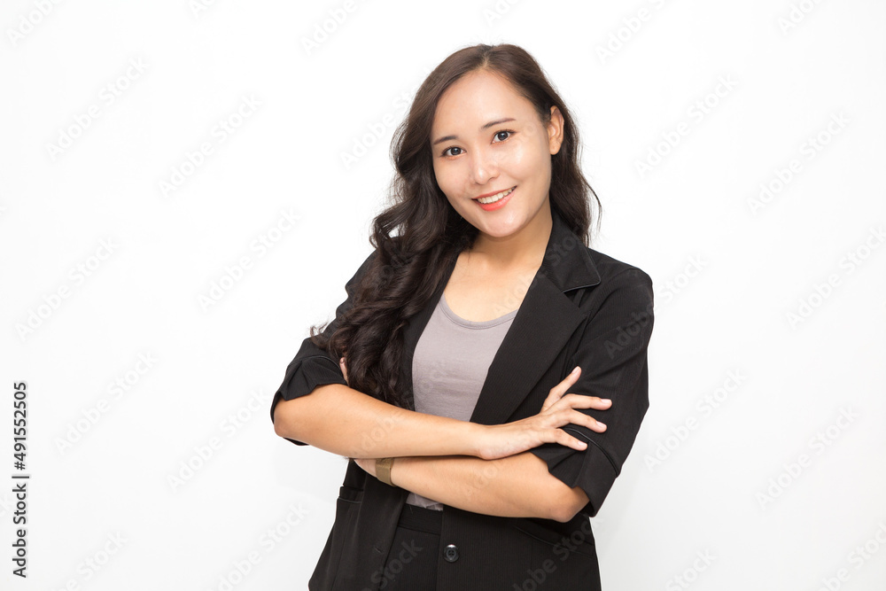 Beautiful Asian business woman wearing black suit with her crossed arms on white background and copy space. Confident Asian working woman smiling and cheerful Beautiful Asian business woman wearing black suit with her crossed arms on white background and copy space. Confident Asian working woman smiling and cheerful