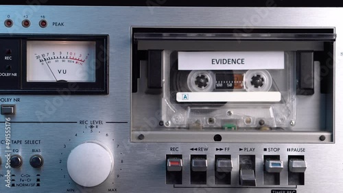 Evidence Audio Recording on Vintage Analog Cassette Tape Playing in Deck, Close Up
