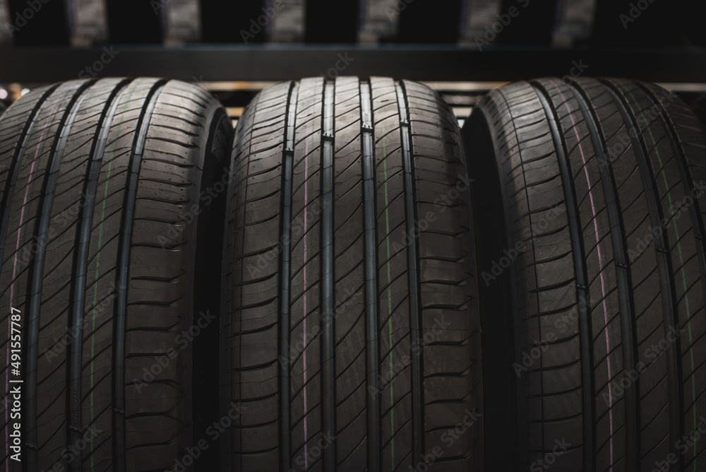 New tire is placed on the tire storage in the car service center. Be prepared for vehicles that need to change tires. New tire is placed on the tire storage in the car service center. Be prepared for vehicles that need to change tires.
