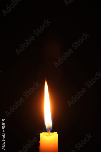 Flame burning candle black background.Concept memory and sorrow.