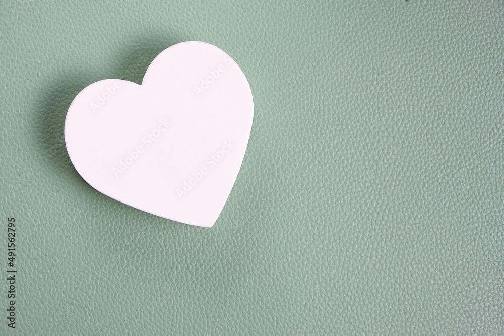 Fototapeta premium White heart green background.Festive background for Valentines Day.